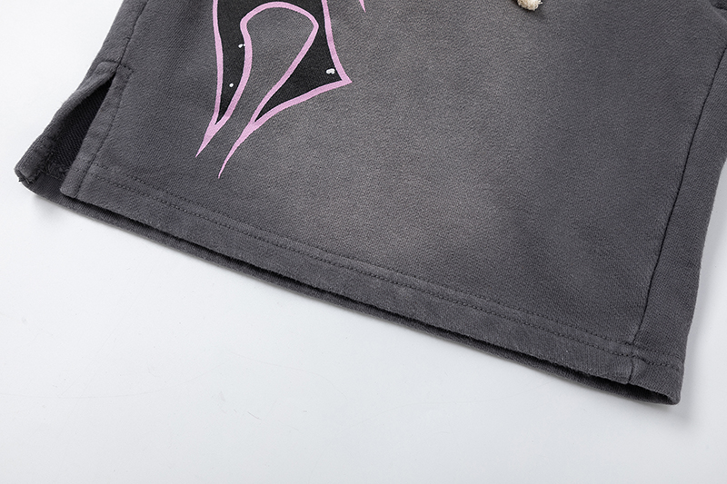 Close-up of Hellstar Studios Records jet black vintage wash shorts with distressed star graphic and drawstring