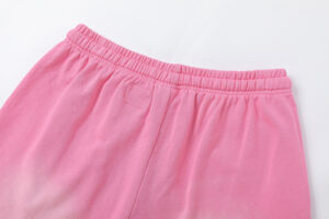 Close-up view of the elastic waistband on the Hellstar Studios Records pink shorts against a plain white background.