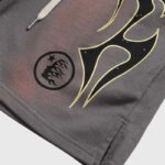 Close-up of the Hellstar Studios Records Shorts in brown featuring high-density screen-printed graphic art and drawstring.