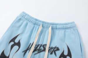 Light blue Hellstar Studios Records shorts featuring graphic prints and an elastic waistband with drawstring closure.