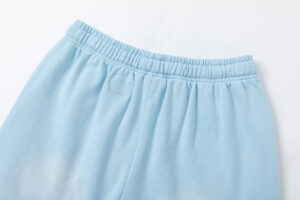 Close up view of the Hellstar Studios Records light blue shorts highlighting the elastic waistband design detail.