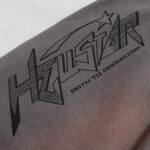 Close-up view of the Hellstar Studios Records grey shorts featuring custom screen-printed star and text graphics.