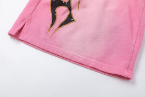 Close-up view of the pink Hellstar Studios Records shorts featuring a detailed graphic print on the cotton fabric.