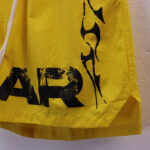 Hellstar Studios Records Star Shorts in bright yellow with bold black graphic print and distressed aesthetic detailing.