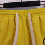 Hellstar Studios Records Star Shorts in yellow featuring a drawstring elastic waistband detail for a relaxed streetwear fit.