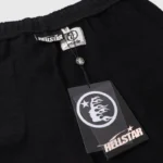 Hellstar Studios Records black tracksuit featuring an authentic Hellstar branding tag and logo details on the clothing.
