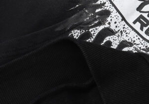 Close up view of the ribbed cuff detail on the Hellstar Studios Records vintage black cotton tracksuit.