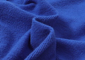 Close-up view of the premium blue fleece fabric used for Hellstar Studios Records Yoga Sweatpants, showing texture.