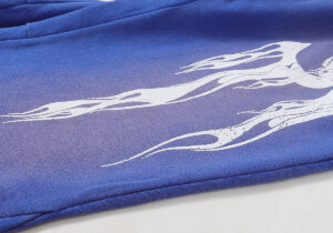 Hellstar Studios Records blue yoga sweatpants featuring a detailed white flame graphic design printed on fleece fabric.