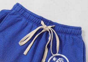 Blue Hellstar Studios Records yoga sweatpants featuring a drawstring waist detail from the front view