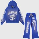 Hellstar Studios Records Yoga Tracksuit in blue with vintage wash, hoodie, and pants featuring unique white flame graphics.