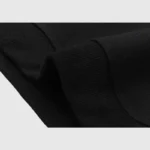 Close-up view of the premium fabric texture and ribbed cuffs on the black Hellstar Studios Sketch Hoodie streetwear.