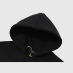 Close-up view of the black Hellstar Studios Sketch Hoodie hood featuring a size tag and drawstring detail.