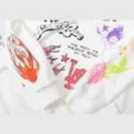 Close-up view of the Hellstar Studios Summer Love white hoodie featuring vibrant screen printed graphic details.