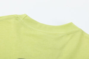 Close up view of the green ribbed collar detail on a Hellstar Studios short sleeve T-shirt garment for streetwear