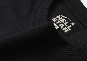 Close-up view of the black Hellstar Studios T-shirt fabric featuring the brand logo on the inside neck collar tag.