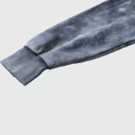 Close-up view of the ribbed sleeve cuff detail on the Hellstar Studios premium washed grey cotton tracksuit set.