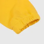 Detail view of the yellow ribbed sleeve cuff on the Hellstar Studios Zipper Sweater showing quality knit fabric.