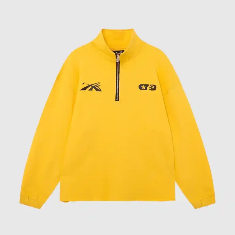 Front view of the vibrant yellow Hellstar Studios zipper sweater featuring a quarter-zip collar and black graphic prints.