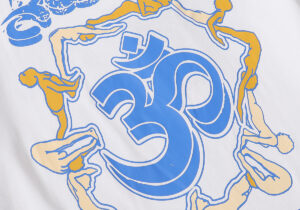 Close-up graphic of the Hellstar Studios Yoga T-Shirt in white, featuring a blue Om symbol and yoga pose artwork.