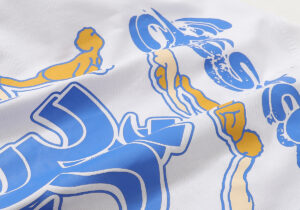 Close-up view of the unique blue and yellow graphic print on the Hellstar Studios white yoga T-shirt fabric.