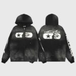 Front and back view of a black Hellstar Studios zip hoodie featuring white graphic branding and unique splatter details.