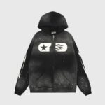 Front view of the Hellstar Studios black zip-up hoodie featuring a white star and flame graphic on the chest.