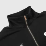 Close-up view of the collar and zipper detail on the black Hellstar Studios casual zipper sweater for men and women.