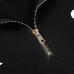 Close-up view of the metallic zipper detail on the premium black cotton Hellstar Studios unisex zipper sweater.