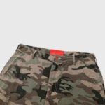 Hellstar Supreme cargo camo pants featuring a durable utility design with a red label detail and premium fabric.