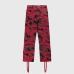 Hellstar Supreme cargo pants featuring a bold red camouflage print design, button closure, and utility pockets.