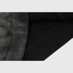 Close-up view of the premium black cotton fleece fabric texture on the Hellstar The Path to Paradise hoodie.