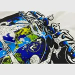 Close-up view of the vintage-washed Hellstar The World Will Be Yours T-Shirt featuring a blue graphic screen print.
