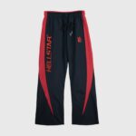 Hellstar Thriller Black Track Pants featuring a red side stripe design with embroidered branding and drawstring waist