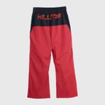 Back view of Hellstar Thriller red and black color-blocked track pants with an embroidered logo on the waistband.