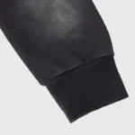 Close-up view of the black ribbed sleeve cuff on the premium heavyweight fleece Hellstar Uniform black hoodie.