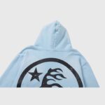 Back view of the Hellstar Uniform Hoodie in baby blue featuring a black circular graphic design with a star and flames.