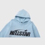 Close-up view of the Hellstar Uniform Hoodie in a vibrant baby blue color featuring the brand's graphic print.