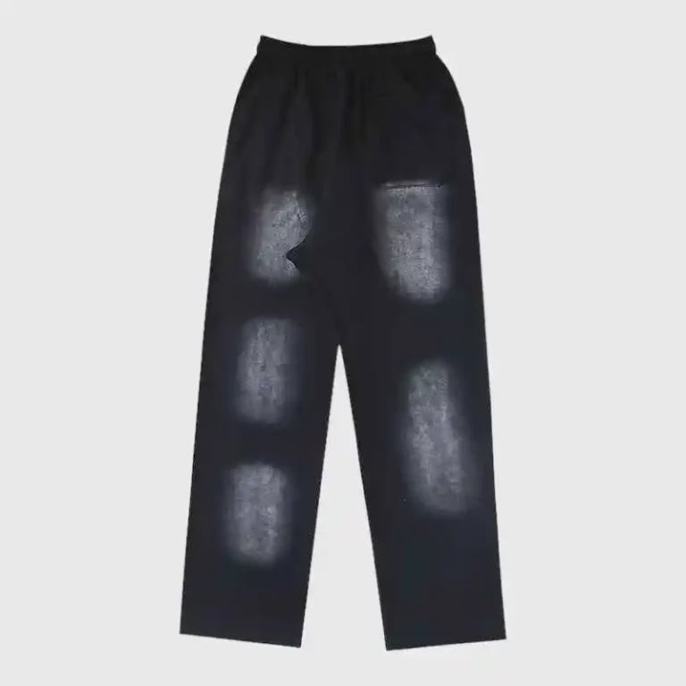 Hellstar Uniform Sweatpant black fleece featuring washed bleach patch details, elastic drawstring waist and side pockets