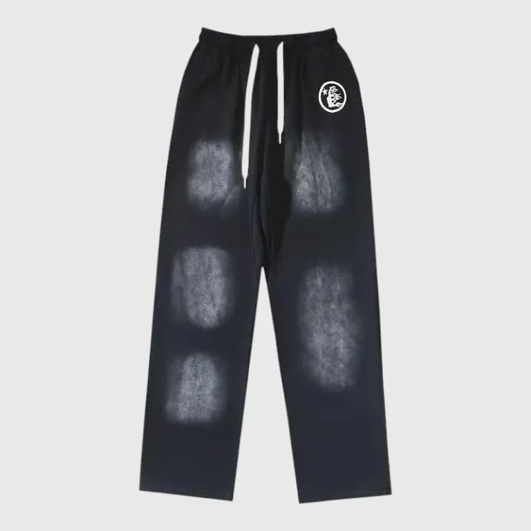 Front view of the black Hellstar Uniform Sweatpant with white drawstring and unique faded graphic print design.
