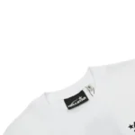 Hellstar unisex white T-shirt collar detail with ribbed crewneck, visible black Hellstar neck label and soft cotton texture