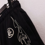 Hellstar black vintage shorts featuring custom white screen-printed graphic details and a comfortable elastic waistband.