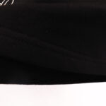 Close-up view of the premium black fleece fabric texture on Hellstar Vintage Shorts featuring durable stitching.