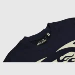 A detailed close-up shot of the Hellstar Warm Up blue T-shirt, highlighting the authentic brand tag inside the neck.