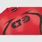Hellstar Warm Up T-Shirt in red featuring a premium vintage washed cotton fabric and unique black graphic print design.