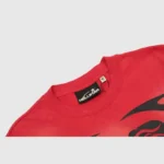 Closeup view of the Hellstar Warm Up T-Shirt in red, showing the inner neck label and premium cotton fabric detail.