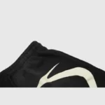 Close-up of the black Hellstar Warm Up Shorts featuring a signature custom white screen-printed graphic detail.