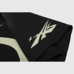 Black Hellstar Warm Up T-shirt sleeve detail featuring a vintage washed graphic screen print on 100% cotton fabric.