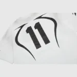 White Hellstar Warm Up T-shirt featuring a bold black graphic print of the number 11 on the back, made in Los Angeles.