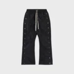 Hellstar black waxed nylon sweatpants with drawstring waist, featuring technical streetwear design and side detailing.